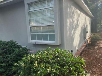 exterior stucco and window of painted house
