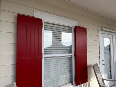 red painted shutter on house exterior