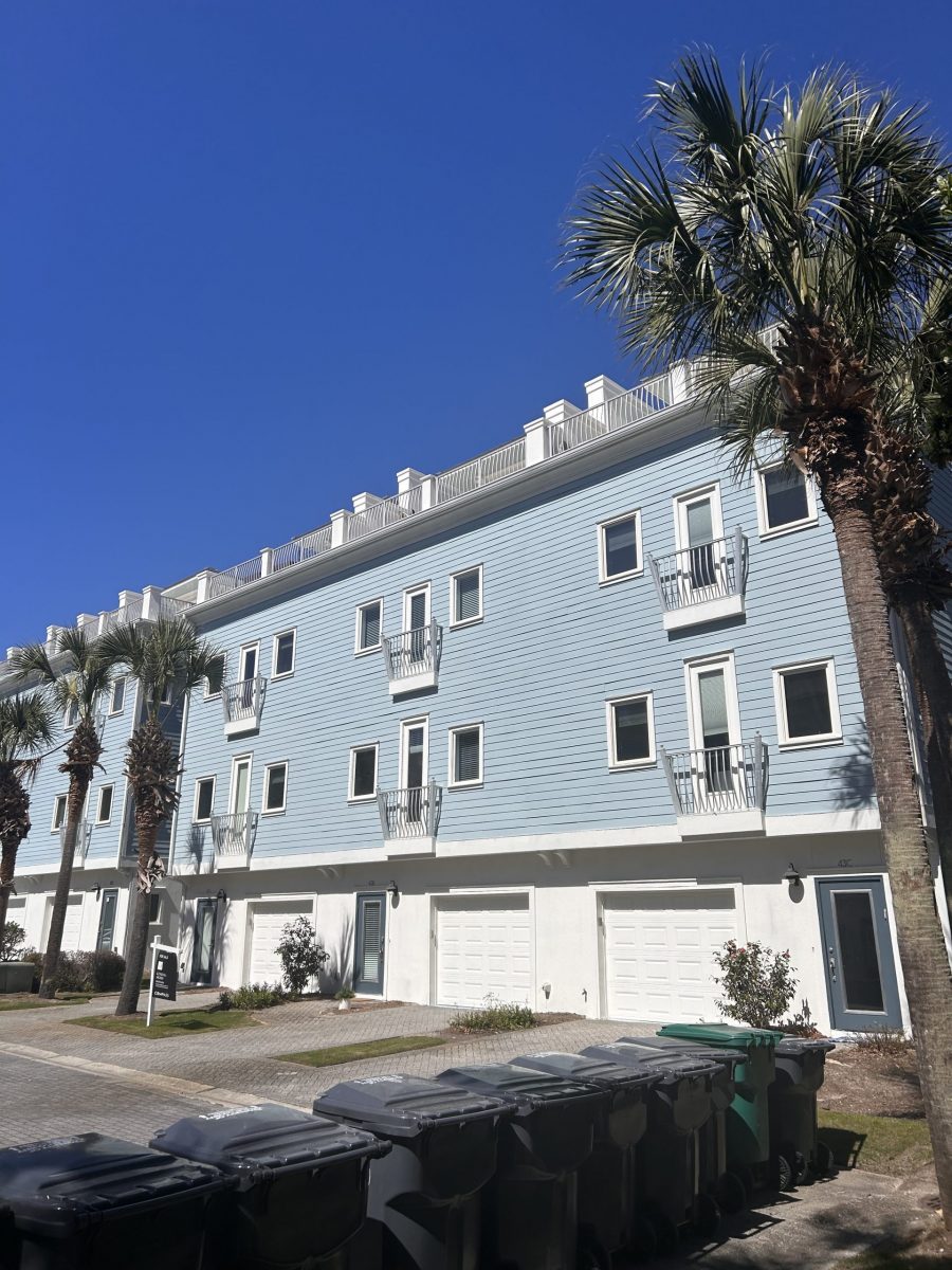 condo building exterior with painted blue siding and white trim and accents Preview Image 9