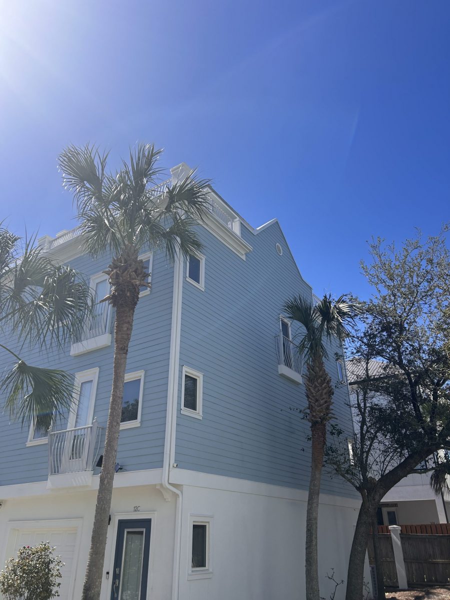 condo building exterior with painted blue siding and white trim and accents Preview Image 6