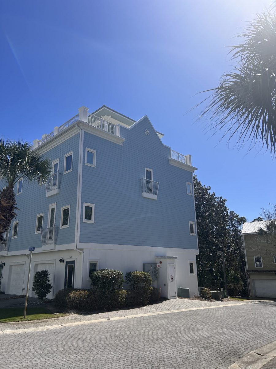 condo building exterior with painted blue siding and white trim and accents Preview Image 4
