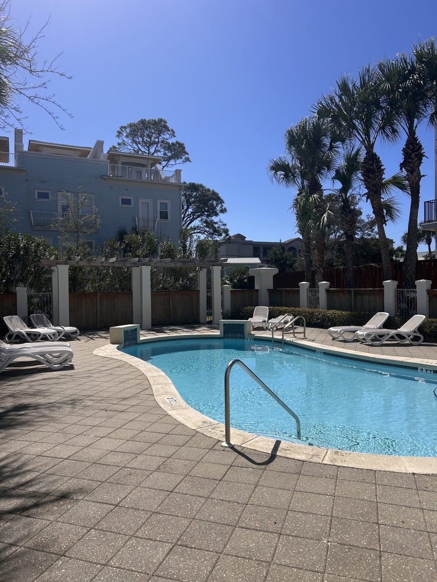 pool area and blue and white painted condo buildngs Preview Image 10