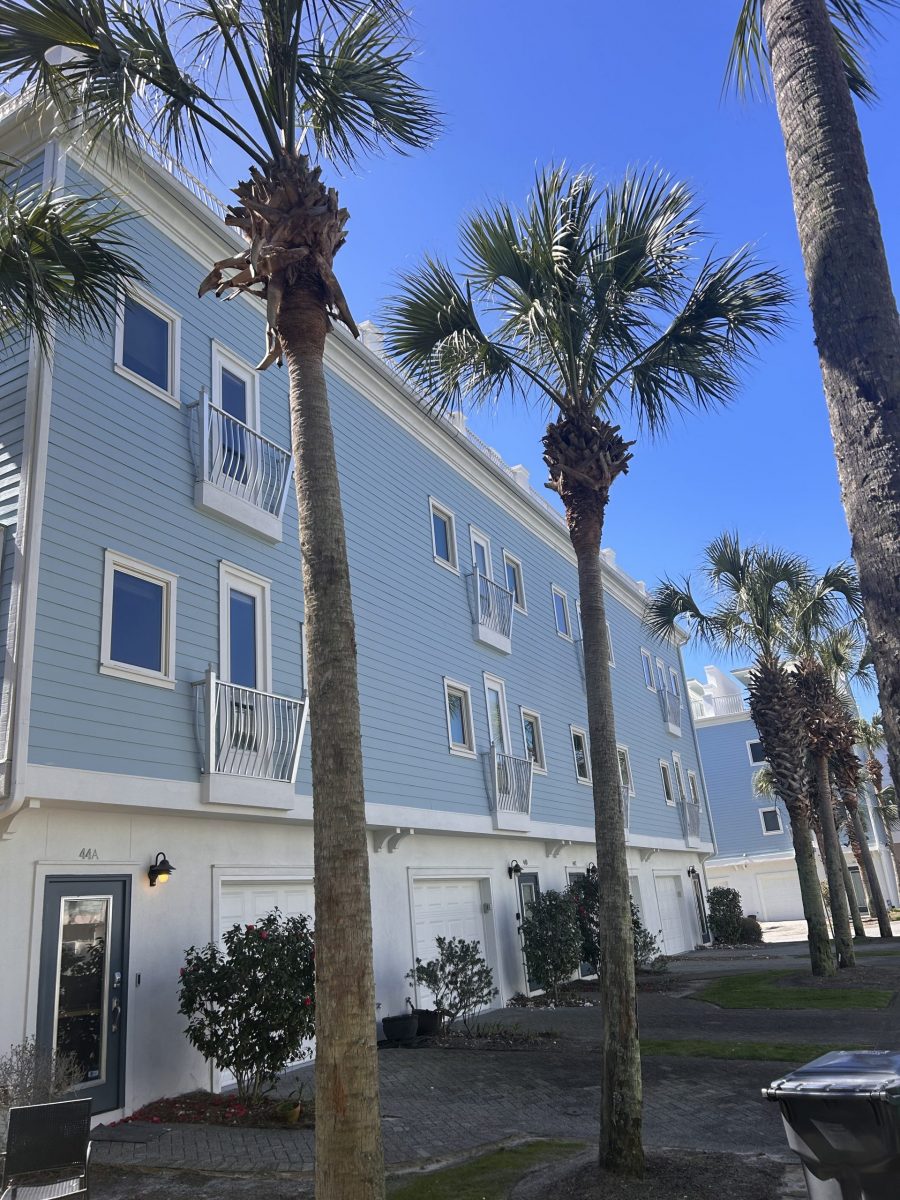 condo building exterior with painted blue siding and white trim and accents Preview Image 1