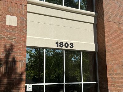 exterior of stucco and brick commercial building