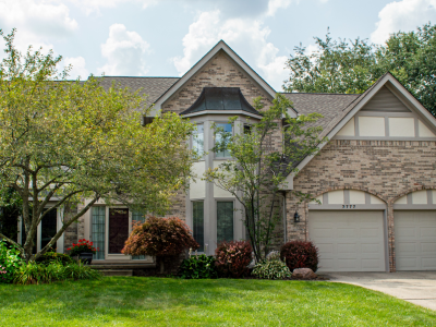 Front view of house and surrounding landscaping