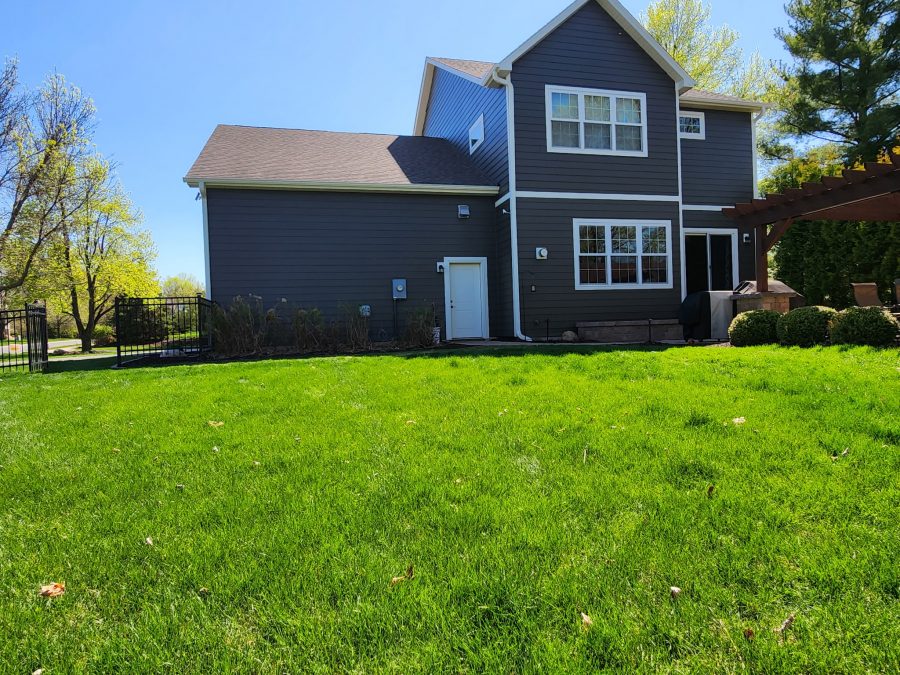 rear side grey painted two story house with yard Preview Image 4