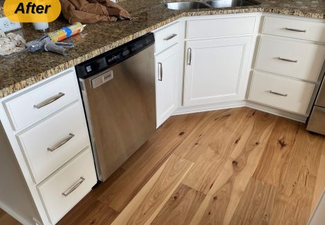 kitchen sink and counter with white painted under cabinets