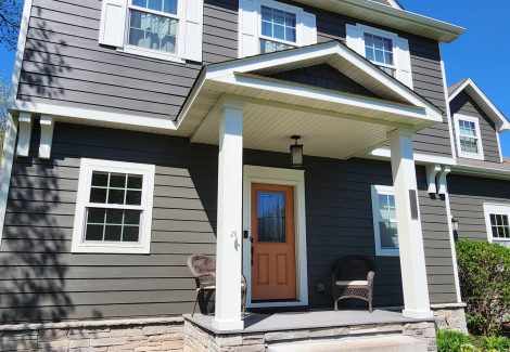 front entrance of house with gray siding