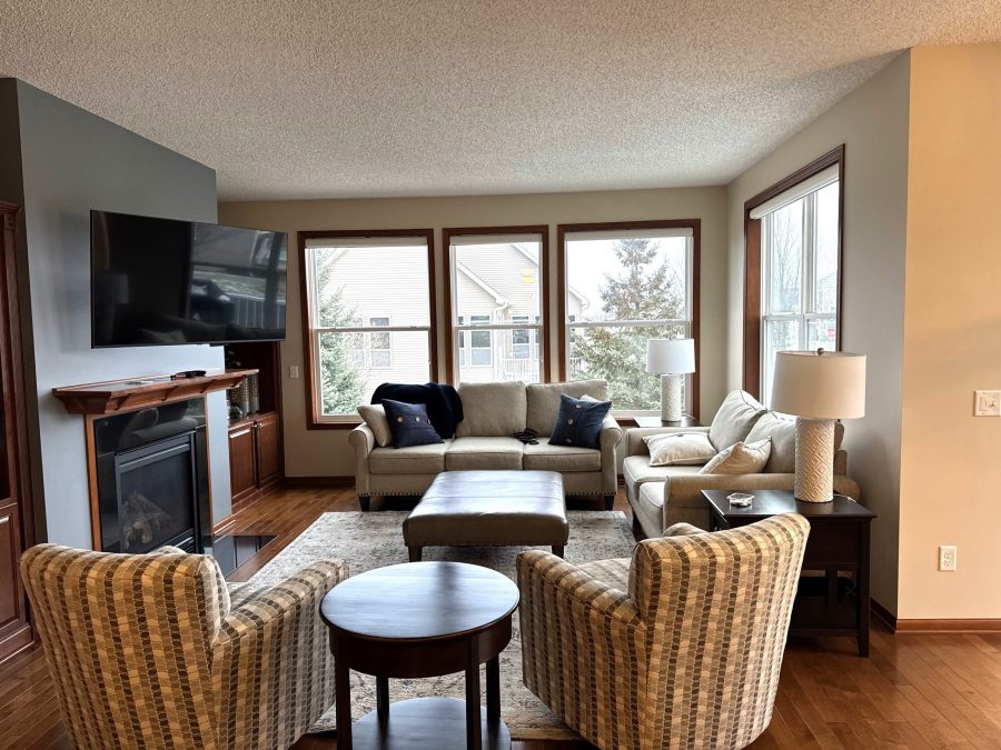 photo of living room with couch and armchairs with freshly painted walls. Preview Image 1