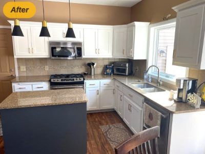 home kitchen with white painted cabinets and blue island