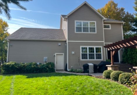 rear side of house with beige siding