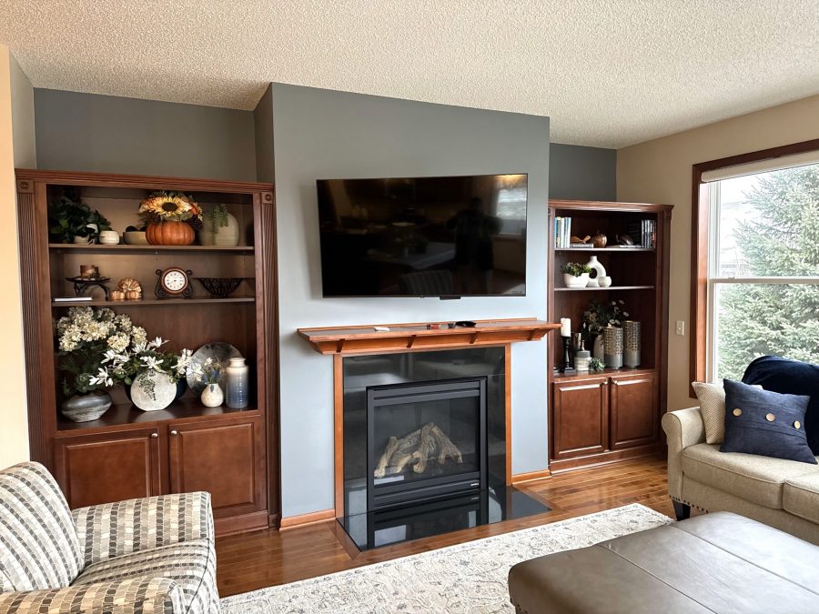 photo of living room fireplace with built in shelves and painted wall. Preview Image 2