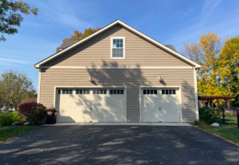 garage side of house with beige siding