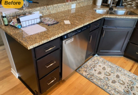 kitchen counter with black cabinets