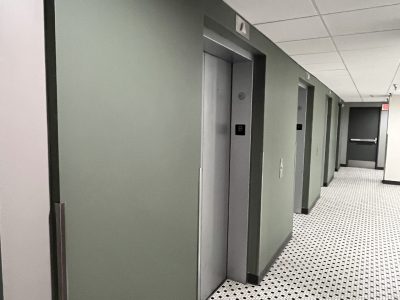 green painted elevator lobby walls