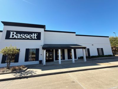 white painted retail building with black trim