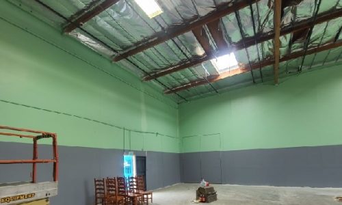 Green and Grey Accent Painted Warehouse Interior
