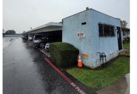 blue apartment building with faded paint