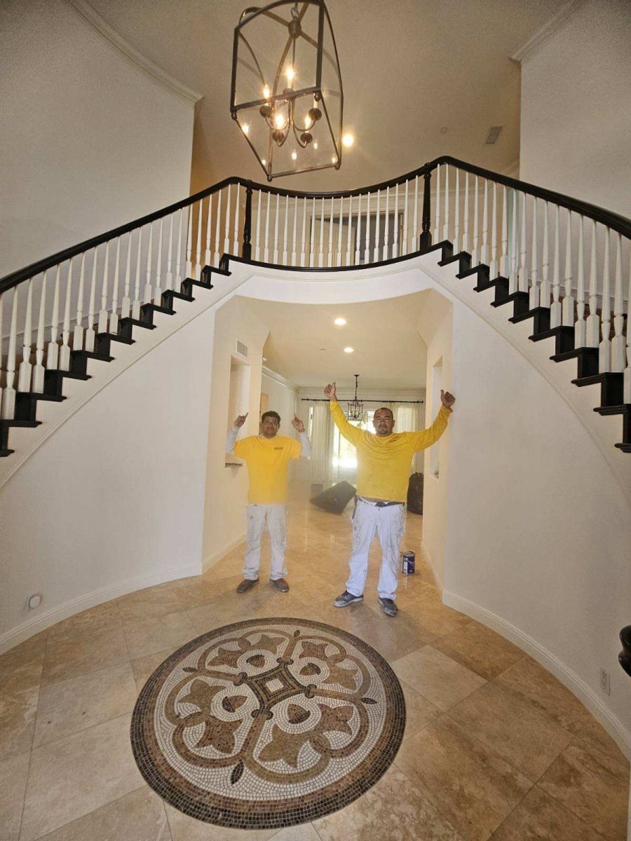 painters posing under painted staircase Preview Image 1