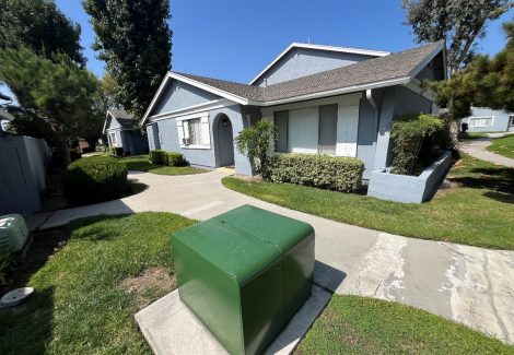 sidewalk view of repainted apartment building