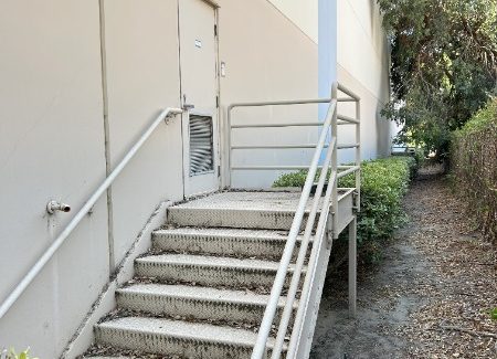 damaged paint on exterior metal stairs