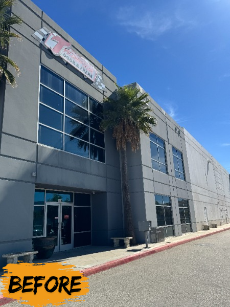 grey commercial building exterior with worn paint Preview Image 1