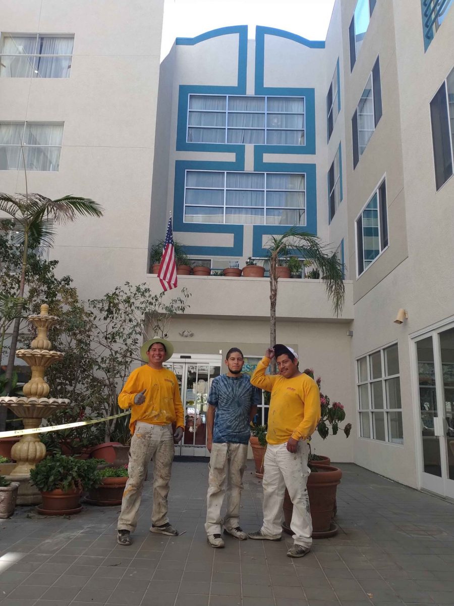 paint team in front of painted retirement community building Preview Image 1