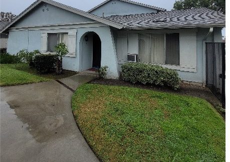 front of apartment building with worn paint