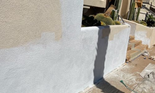 After the stucco is patched and primed.