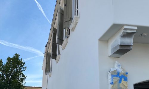 Sideview of Home During Paint Application