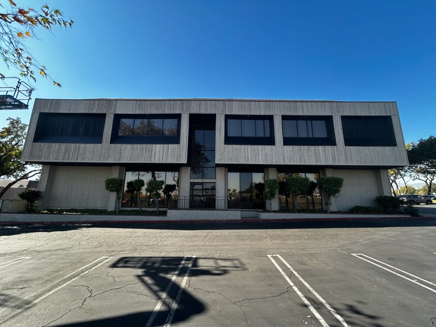 front of commercial building with painted siding and window frames Preview Image 1