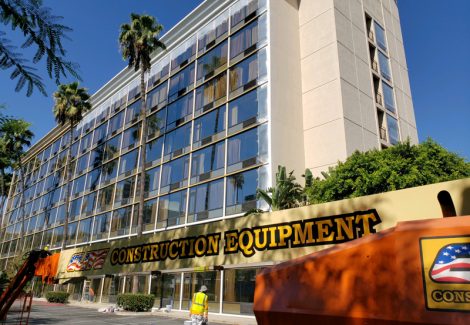 boom lift in front of hotel