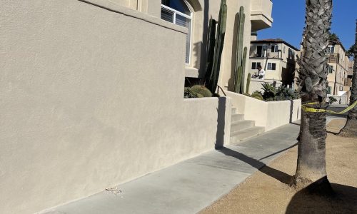 After the removal, patching, and painting, the wall looks like new.