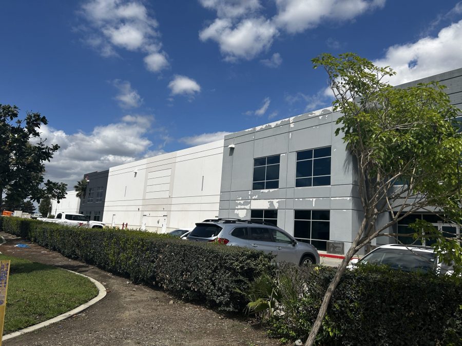 grey commercial building exterior with worn paint Preview Image 4