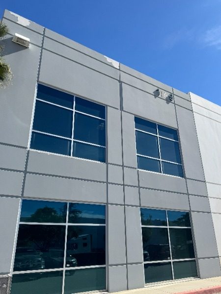 grey commercial building exterior with worn paint Preview Image 2