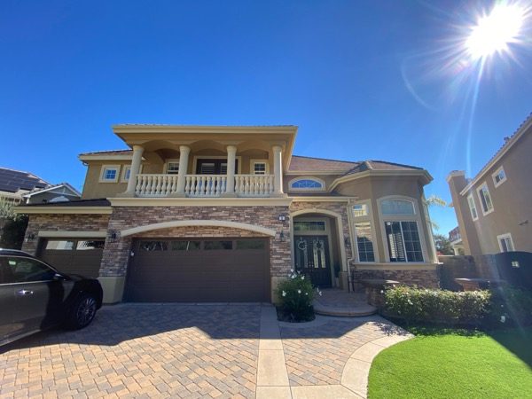 stone and stucco house exterior with brown garage door before repaint Preview Image 9