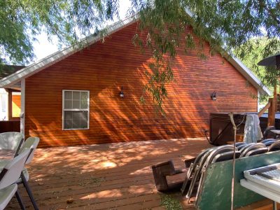 wooden house exterior staining after