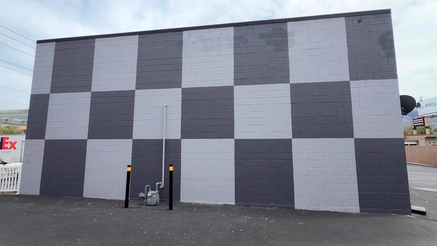 concrete commercial building with dark and light grey checkered paint design Preview Image 1