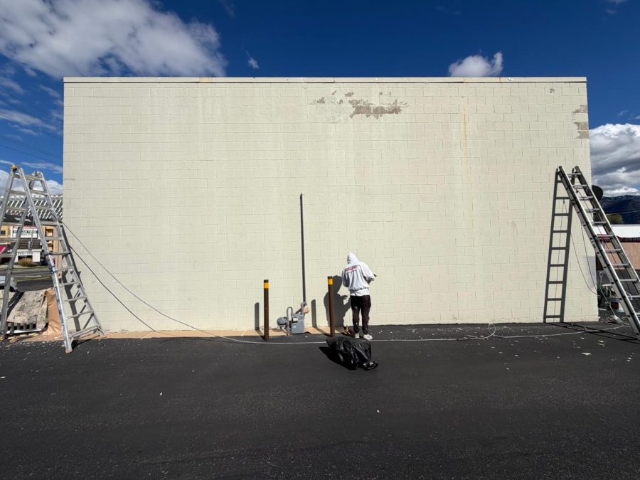 painter priming concrete commercial building exterior Preview Image 2