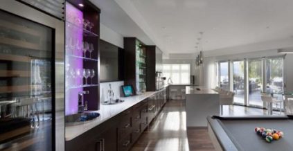 Wood Stained Cabinetry & Flooring and White Walls ...