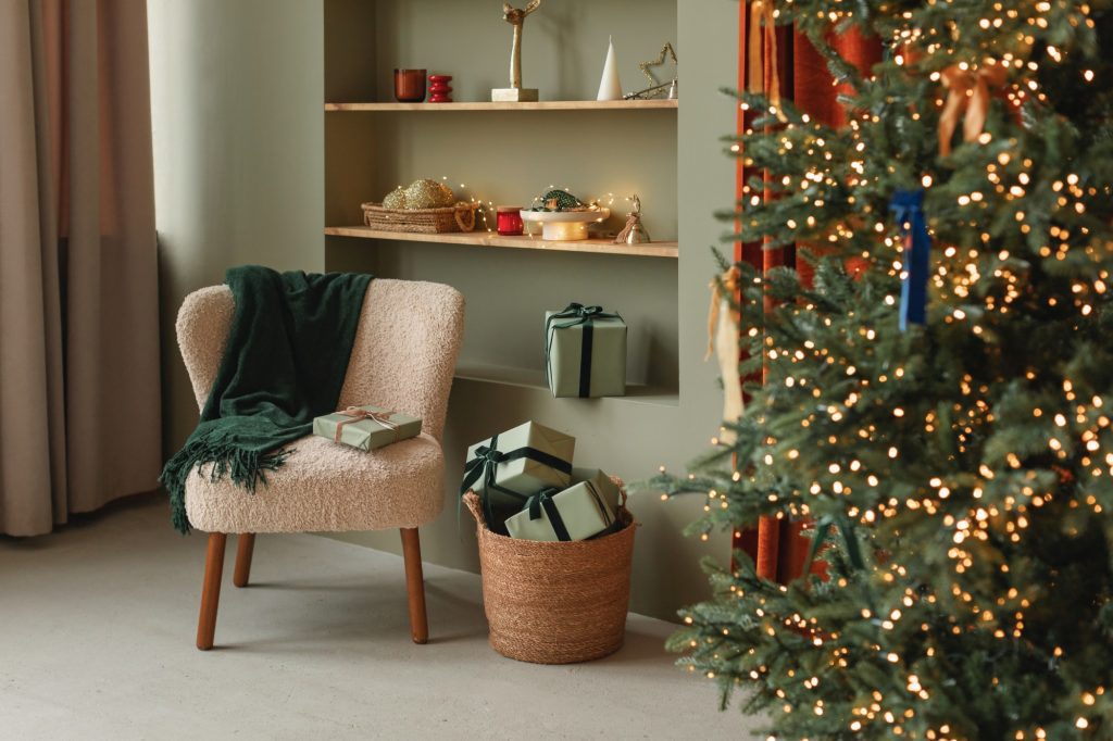 living room with christmas tree and green walls