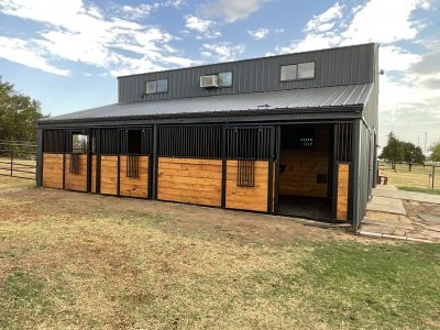 horse stables with stained wood and painted accents