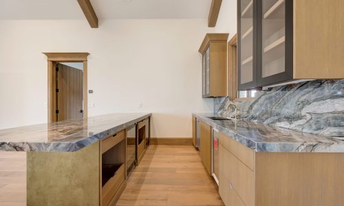 Brown Cabinets with Granite Countertops
