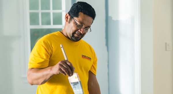 painter loading paint brush