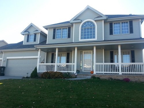 Exterior house painting by CertaPro painters in West Omaha, NE