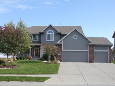 Exterior house painting by CertaPro painters in Gretna, NE