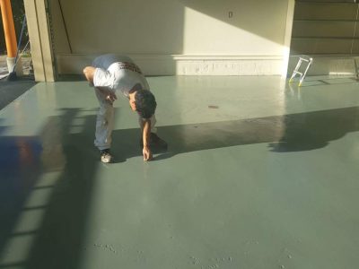 CertaPro Painters of Orange County, NY, crew member with epoxy floor coating project in Goshen, NY