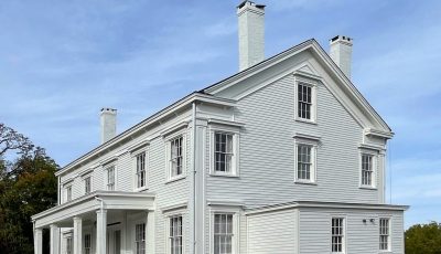 Completed commercial exterior painting project at this Greek revival mansion in Warwick, NY by CertaPro Painters of Orange County, NY - Side Angle 2