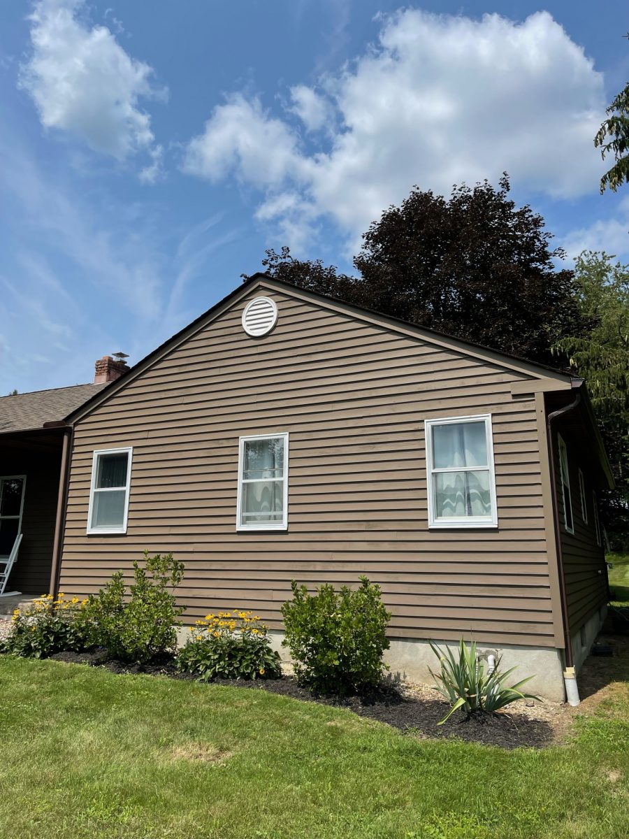 Side of home in Goshen, NY, after completed residential exterior painting project by CertaPro Painters of Orange county, NY Preview Image 1