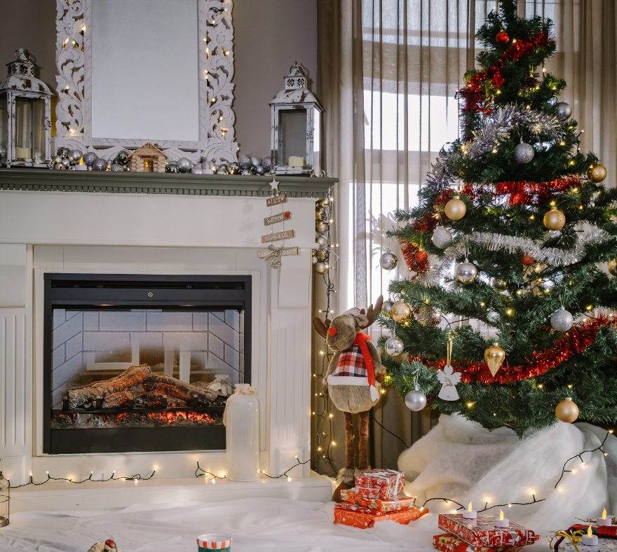 living room with fireplace and holiday tree